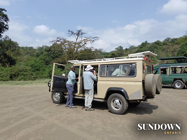 Sundown guests and their vehicle between game drives