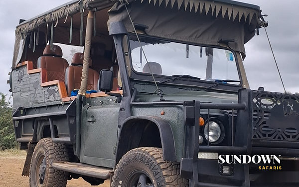 Open sided safari Land Rover ready for a game drive in Kenya, Sundown Safaris 3 Day Explorer private safari